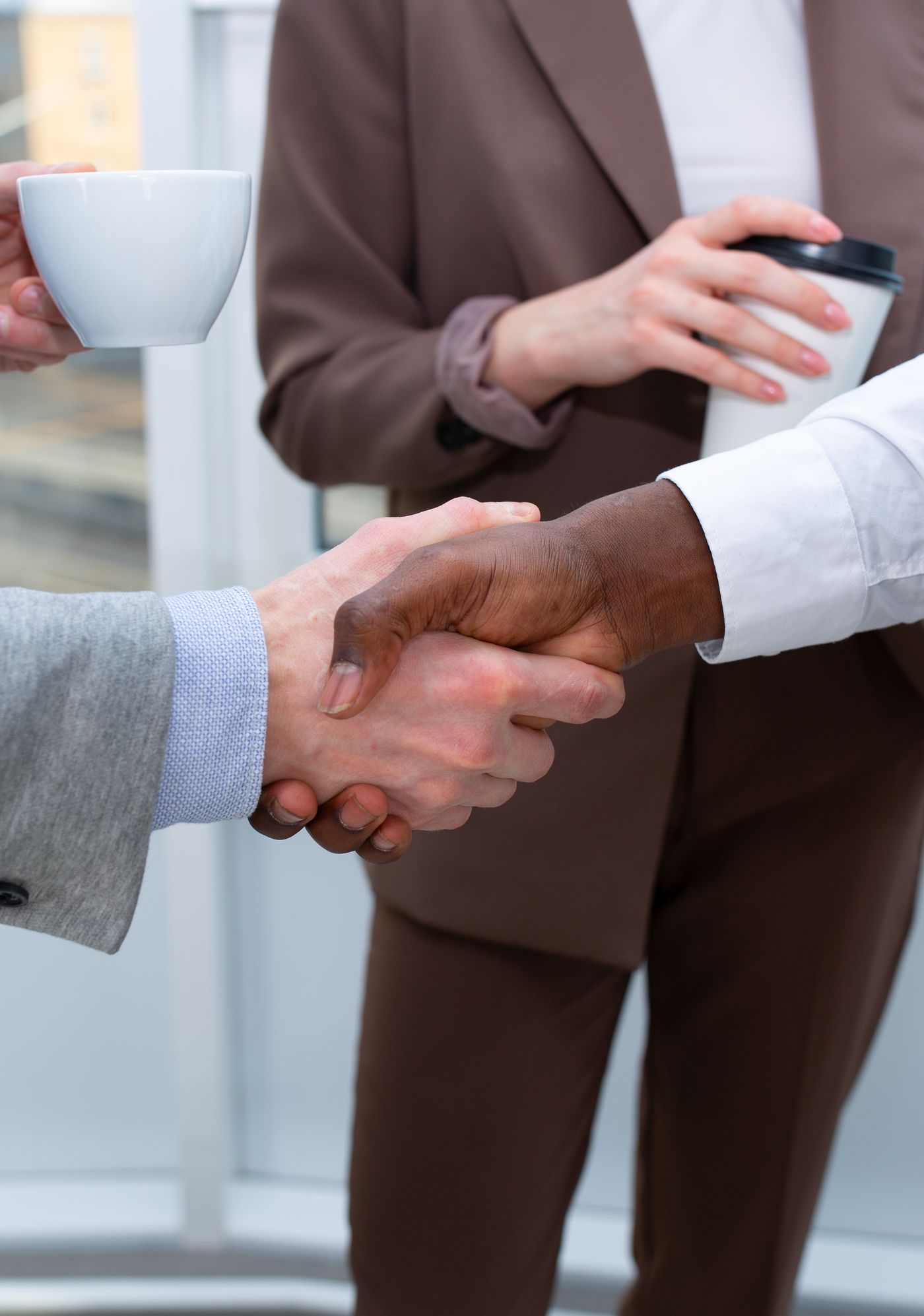 Business partners shaking hands after a successful audit engagement